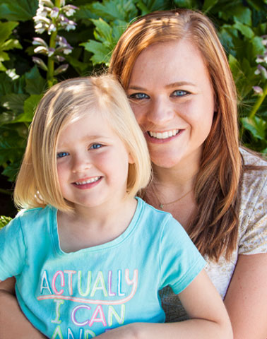 Woman and daughter smiling